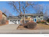 Charming home featuring a two-car garage and a quaint front porch, perfect for relaxing outdoors at 1631 Centaur Cir, Lafayette, CO 80026