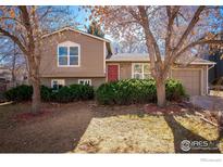 Ranch style home with mature trees and landscaping at 402 Baron Ave, Lafayette, CO 80026