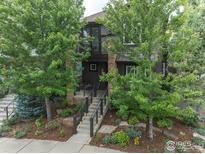 Two-story home with landscaped yard and inviting front porch at 5065 3Rd St, Boulder, CO 80304