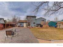 A spacious backyard with a patio and gravel area, perfect for outdoor entertaining and relaxation at 614 Glenwood Dr, Lafayette, CO 80026