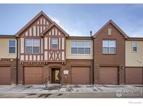 Beautiful townhome exteriors showing garages and unique architectural details at 1379 Charles Dr # 4, Longmont, CO 80503