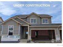 Under construction, this home features a stylish exterior with a two-car garage and modern design at 16815 Mckay Dr, Mead, CO 80542