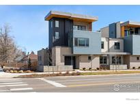 Modern home with a combination of brick, steel, and light-blue siding accents at 2160 Folsom St, Boulder, CO 80302