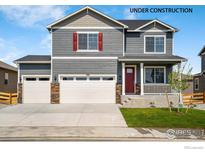 Two-story home featuring gray siding, red shutters, a red front door, a small porch, and a three-car garage at 298 Chardon Ave, Brighton, CO 80601