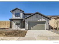 Charming two-story home with attached two-car garage and modern farmhouse-style architecture at 3109 Newfound Lake Rd, Berthoud, CO 80513