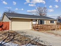 Charming single-story home with brick exterior, accessible ramp, and well-maintained landscaping at 18931 E Brunswick Pl, Aurora, CO 80013