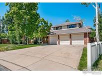 Charming two-story home with a three car garage, mature trees and a large driveway at 4672 Kirkwood Ct, Boulder, CO 80301
