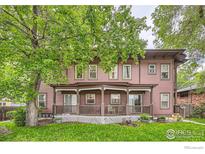 Charming two-story home with a covered front porch and well-maintained lawn at 820 Kimbark St # B, Longmont, CO 80501