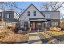 Charming home with a welcoming orange front door and neat landscaping at 4464 N Raleigh St, Denver, CO 80212