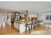 Spacious kitchen with a large island, counter seating, and modern stainless steel appliances at 7240 Clubhouse Rd, Boulder, CO 80301