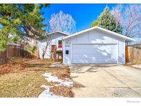 Charming home with a two-car garage and a cozy front porch at 1507 Atwood St, Longmont, CO 80501