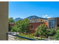 View of the city with trees, buildings, and mountains in the background on a beautiful sunny day at 2030 20Th St # 7, Boulder, CO 80302