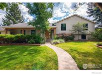 Charming home featuring a well-manicured front yard and a welcoming entrance, perfect for a Gathering at 290 Mohawk Dr, Boulder, CO 80303