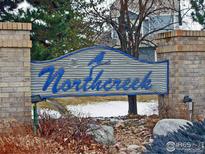 Welcoming Northcreek sign features a charming design at the entrance to the residential community at 3349 Sentinel Dr, Boulder, CO 80301