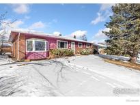 Charming single Gathering home featuring a vibrant exterior and a spacious driveway covered in snow at 805 38Th St, Boulder, CO 80303