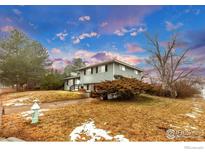 Two-story home with landscaped yard and blue sky at 4493 Hamilton Ct, Boulder, CO 80305