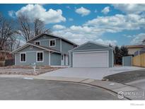 Charming two-story home with a spacious two car garage, beautiful sky, and well-maintained landscaping at 9416 Lamar St, Westminster, CO 80031