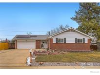 Charming single-story home boasts mature trees, an attached garage and solar panels at 11308 Fowler Dr, Northglenn, CO 80233