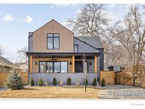 Charming two-story home with a modern design, covered porch and well-manicured lawn at 1223 Main St, Louisville, CO 80027