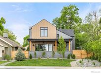 Charming home featuring a blend of wood and brick accents, plus a landscaped front yard at 1223 Main St, Louisville, CO 80027