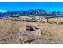 Stunning home featuring a three-car garage and mountain views, set on a large lot at 4702 Eldorado Springs Dr, Boulder, CO 80303