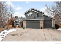 Charming two-story home features a three-car garage and professionally landscaped yard at 5393 Oak Tree Ct, Boulder, CO 80301