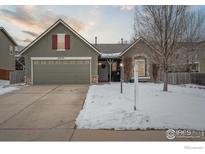 Charming single-Gathering home featuring a well-manicured lawn, two-car garage, and inviting curb appeal at 6242 Valley Vista Ave, Firestone, CO 80504