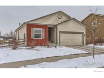 Charming single-Gathering home with a two-car garage and well-maintained lawn during winter at 7333 Ellingwood Cir, Frederick, CO 80504