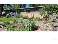 Charming home with a beautifully landscaped front yard and rock garden at 1315 Aspen St, Longmont, CO 80501