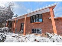 Charming brick home with a covered porch and a large bay window at 255 Iroquois Dr, Boulder, CO 80303