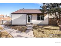 Charming single-Gathering home featuring well-maintained landscaping and neutral-colored siding at 972 S Zeno Way, Aurora, CO 80017