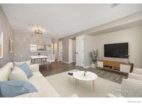 Bright living room featuring neutral colors, modern furnishings, and a cozy dining area at 1175 S Gilbert St, Castle Rock, CO 80104