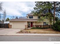 Charming two-story home with a two-car garage and a well-manicured front yard at 1400 Athene Dr, Lafayette, CO 80026