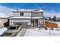 Charming two-story home with a two-car garage and a well-maintained front yard at 14860 Guernsey Dr, Mead, CO 80542