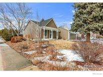 Charming two-story home with a brown exterior, a well-manicured lawn, and mature trees in a quiet neighborhood at 195 S Cleveland Ave, Louisville, CO 80027