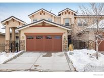 Charming home featuring a two-car garage and elegant stone accents, complemented by a well-maintained driveway at 2966 Casalon Cir, Superior, CO 80027