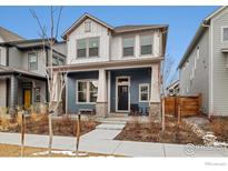 Charming two-story home with a welcoming front porch and attractive curb appeal at 6334 N Dayton Way, Denver, CO 80238