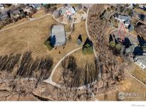 A birds eye view of a home close to the park including a ice rink and playground at 1002 Willow Ct, Longmont, CO 80503