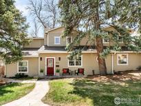 Charming two-story home with a red front door and a lush, green lawn at 1516 Columbine Ave, Boulder, CO 80302