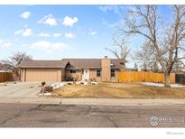Charming single-story home featuring a spacious front yard and attached two-car garage at 3545 W 132Nd Pl, Broomfield, CO 80020