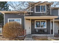 Charming home featuring a cozy front porch with seating and well-maintained landscaping at 51 21St Ave # 30, Longmont, CO 80501