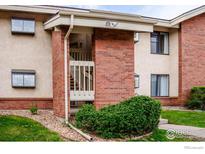 Brick condo featuring covered entry and well-maintained landscaping in a desirable neighborhood at 595 Manhattan Dr # 203, Boulder, CO 80303