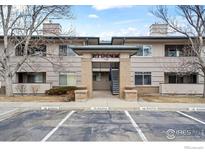 Attractive condominium exterior with reserved parking spaces and easy access to the building at 710 Copper Ln # 102, Louisville, CO 80027
