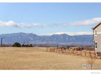 Expansive backyard view featuring scenic mountain range at 55 Morgan S Cir, Erie, CO 80516