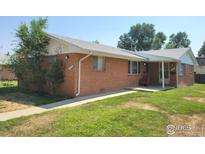 Charming single-story home with a well-maintained lawn and inviting curb appeal at 117 Valentine Ln, Longmont, CO 80501