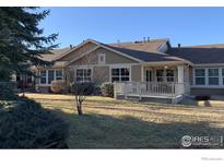 Spacious backyard featuring a well-maintained lawn and a charming deck perfect for outdoor entertaining at 15346 Heritage Cir, Thornton, CO 80602