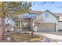 Charming two-story home featuring a two-car garage, covered porch, and professionally landscaped front yard at 4007 Sandcherry Pl, Longmont, CO 80503