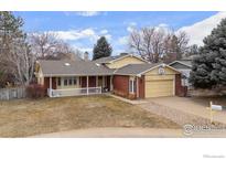 Charming single-Gathering home with a brick facade, covered porch, and attached garage at 5266 Gallatin Pl, Boulder, CO 80303