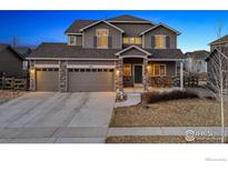 Charming two-story home with a three-car garage and a welcoming front porch at 684 Biscayne Ct, Berthoud, CO 80513