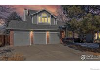 Charming two-story house with three-car garage and brick accents at 11563 W 67Th Ave, Arvada, CO 80004